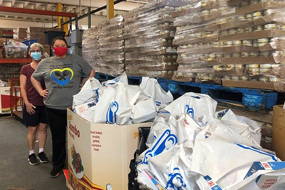 Facing Hunger Volunteers in warehouse