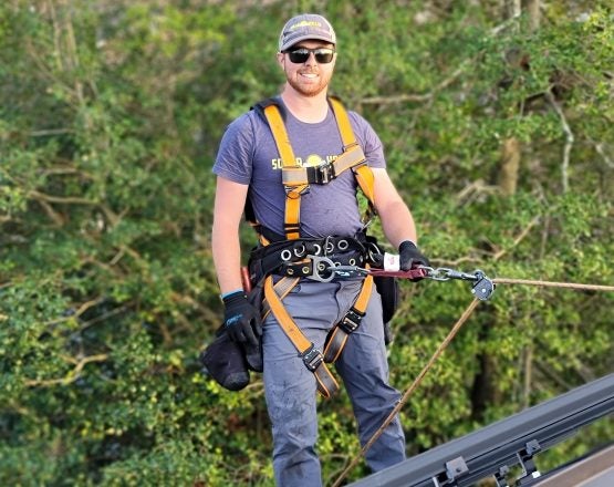 Solar Panel Installer on Roof